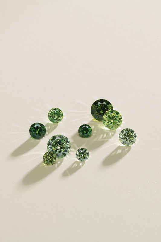 green zirconia stones on a white background