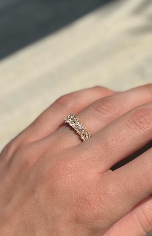 clear zirconia stone ring on a hand with soft sunlight