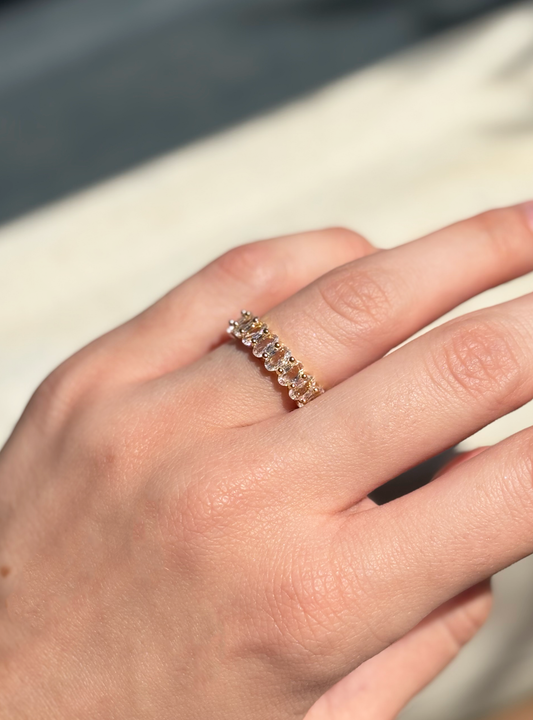 clear zirconia stone ring on a hand with soft sunlight
