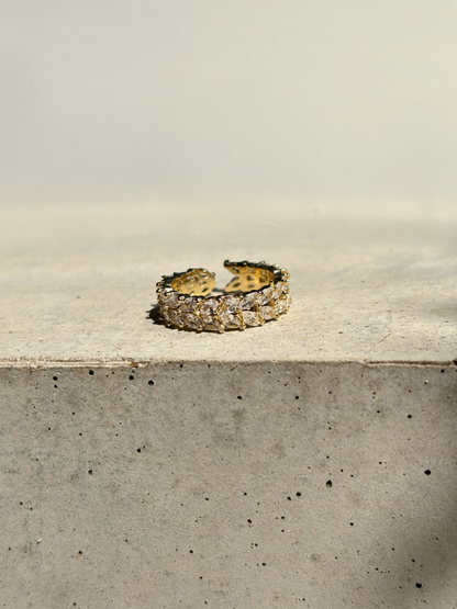 clear zirconia stone ring on a concrete plate with soft sunlight