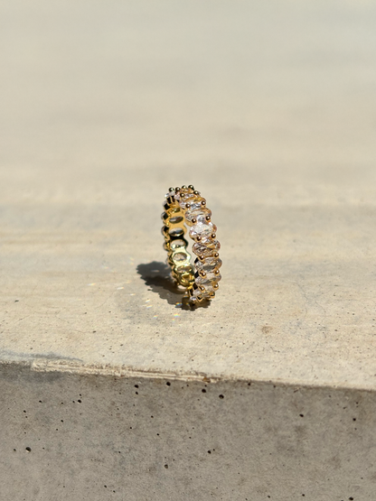 clear zirconia stone ring on a concrete plate with soft sunlight