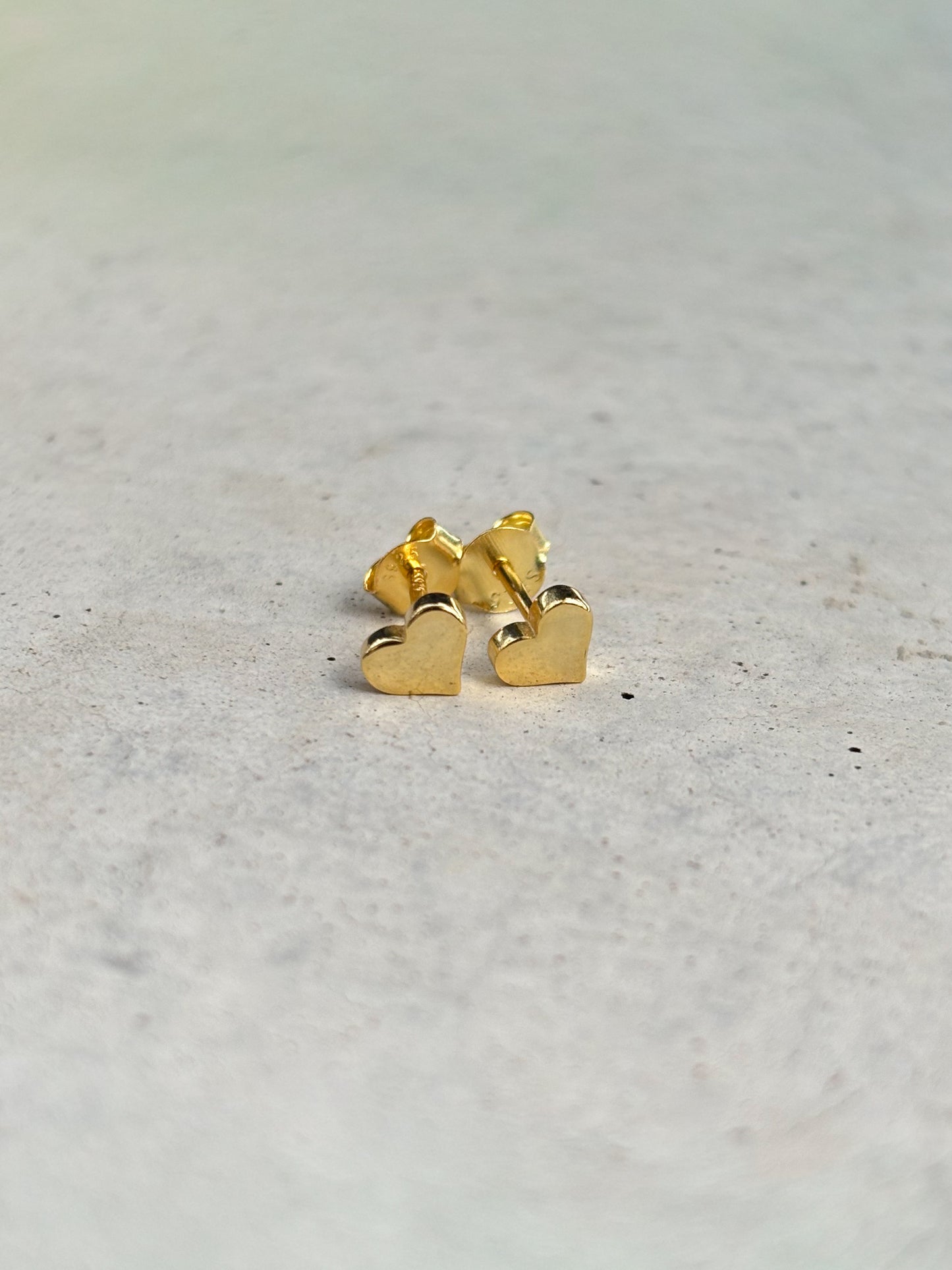 golden heart-shaped earrings