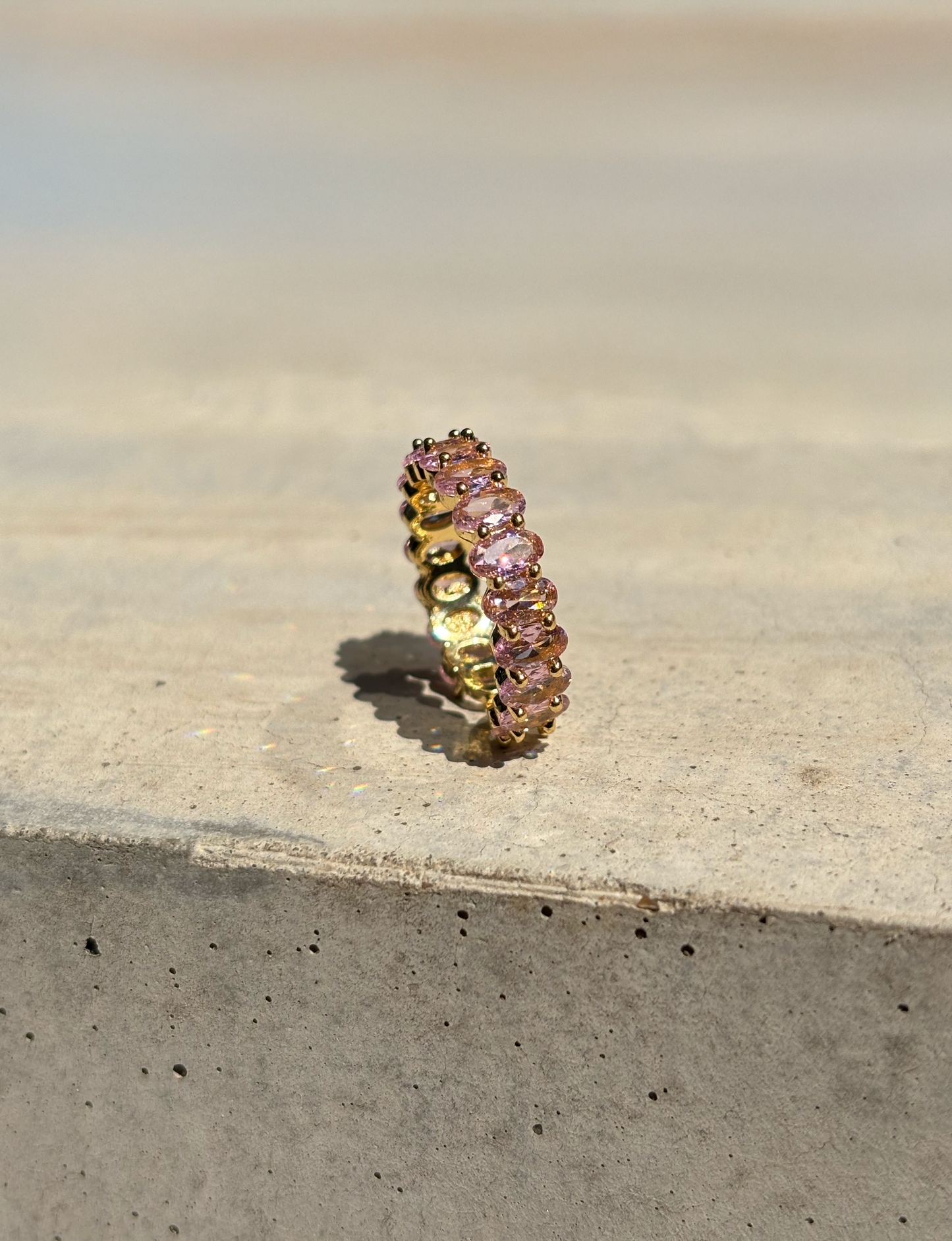 love zirconia stone ring on a concrete plate with soft sunlight